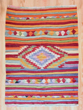 Load image into Gallery viewer, 5x7 Vintage Anatolian Turkish Kilim Area Rug | Strips with vibrant colors and bold medallion | SKU 417