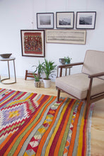 Load image into Gallery viewer, 5x7 Vintage Anatolian Turkish Kilim Area Rug | Strips with vibrant colors and bold medallion | SKU 417