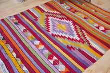 Load image into Gallery viewer, 5x7 Vintage Anatolian Turkish Kilim Area Rug | Strips with vibrant colors and bold medallion | SKU 417