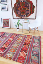 Load image into Gallery viewer, 5x8 Vintage Anatolian Turkish Kilim Area Rug | Strips with vibrant colors and bold symbols | SKU 452