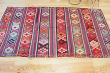 Load image into Gallery viewer, 5x8 Vintage Anatolian Turkish Kilim Area Rug | Strips with vibrant colors and bold symbols | SKU 452