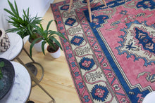 Load image into Gallery viewer, 6x9 Vintage Central Anatolian &#39;Nigde&#39; Turkish Area Rug | Unique medallion design on pink field geometric border | SKU 396
