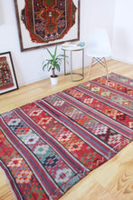 Load image into Gallery viewer, 5x8 Vintage Anatolian Turkish Kilim Area Rug | Strips with vibrant colors and bold symbols | SKU 452
