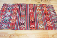 Load image into Gallery viewer, 5x8 Vintage Anatolian Turkish Kilim Area Rug | Strips with vibrant colors and bold symbols | SKU 452
