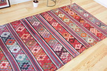 Load image into Gallery viewer, 5x8 Vintage Anatolian Turkish Kilim Area Rug | Strips with vibrant colors and bold symbols | SKU 452

