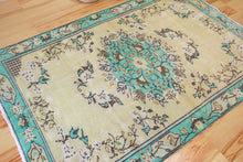 Load image into Gallery viewer, 5x8 Vintage Central Anatolian Oushak Style Turkish Area Rug | Bold turquoise medallion and border chartreuse field | SKU 508
