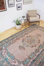 Load image into Gallery viewer, 6x10 Vintage Central Anatolian Oushak Style Turkish Area Rug | Bold medallion spacious field floral border | SKU 511
