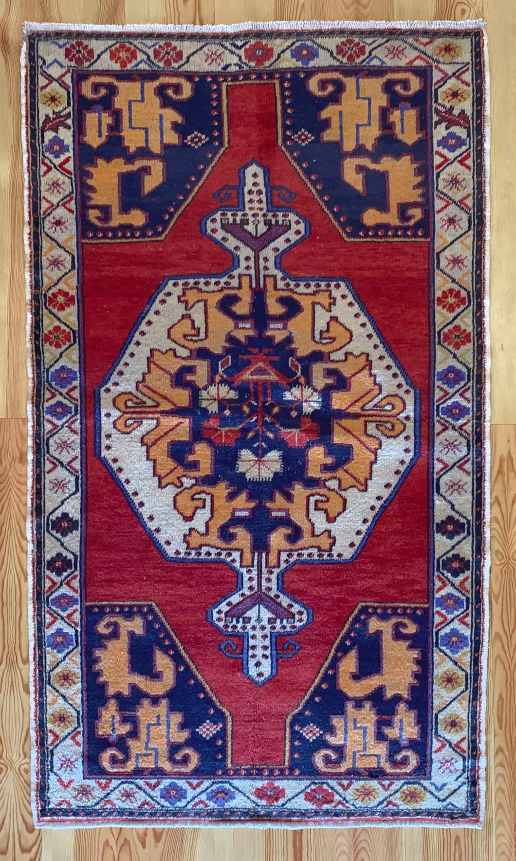 4x8 Vintage Central Anatolian 'Nigde' Turkish Area Rug | Bold Medallion on Red Field Stylized Corner Design Geometric Border Vibrant Colors | SKU 657